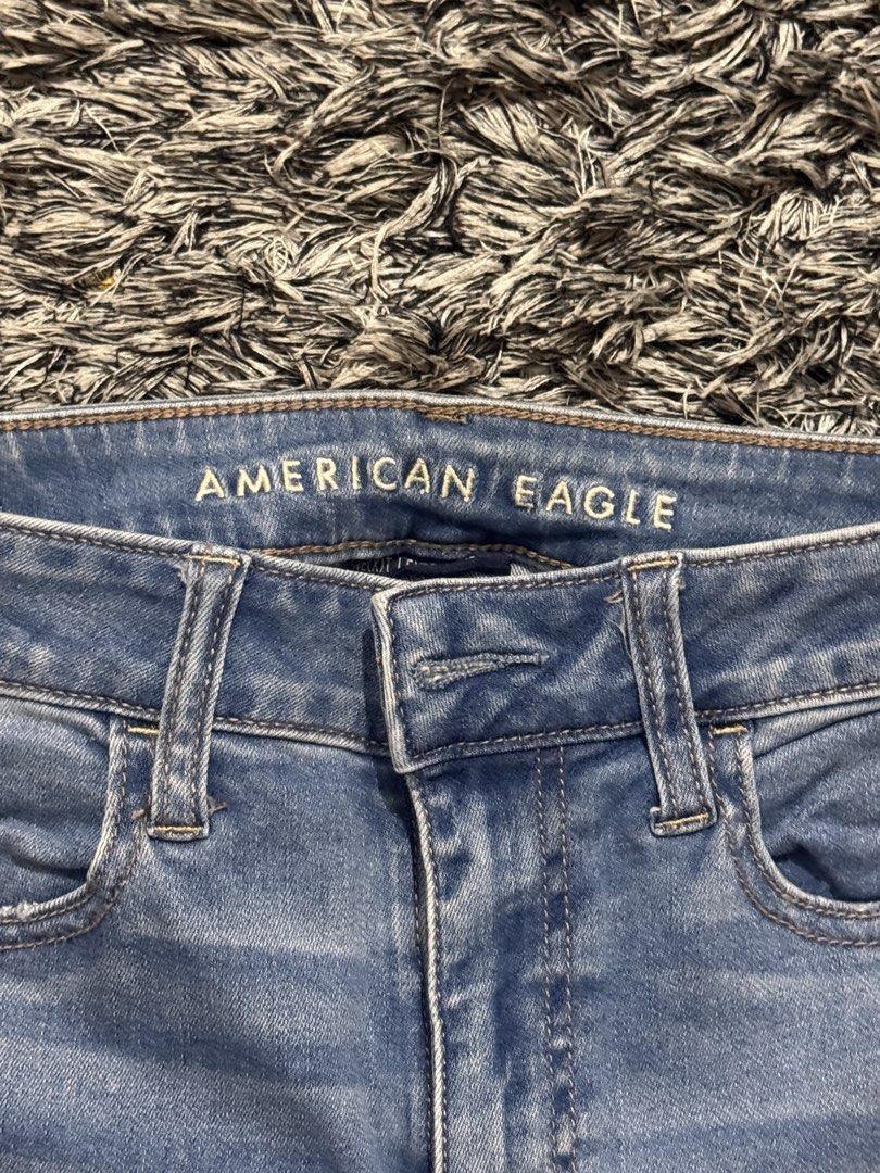 American Eagle Side Stripe Light Wash Jeans (Category: Jeans) located in General Santos City (Dadiangas). Submitted by au.abtzl (Listing ID 1467959005, Image 2). Description: - Brand: American Eagle - Wash: Light wash denim - Details: Eye-catching maroon, white, and navy vertical side stripes on both legs - Hem: Trendy raw, distressed ankle hems - Style: Classic five-pocket layout with traditional back pocket stitching and leather back waistband 