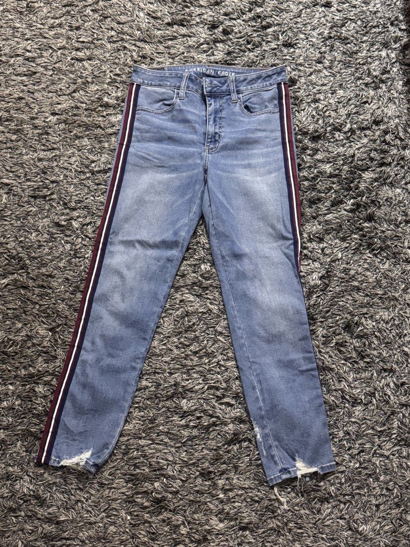 American Eagle Side Stripe Light Wash Jeans (Category: Jeans) located in General Santos City (Dadiangas). Submitted by au.abtzl (Listing ID 1467959005, Image 1). Description: - Brand: American Eagle - Wash: Light wash denim - Details: Eye-catching maroon, white, and navy vertical side stripes on both legs - Hem: Trendy raw, distressed ankle hems - Style: Classic five-pocket layout with traditional back pocket stitching and leather back waistband 
