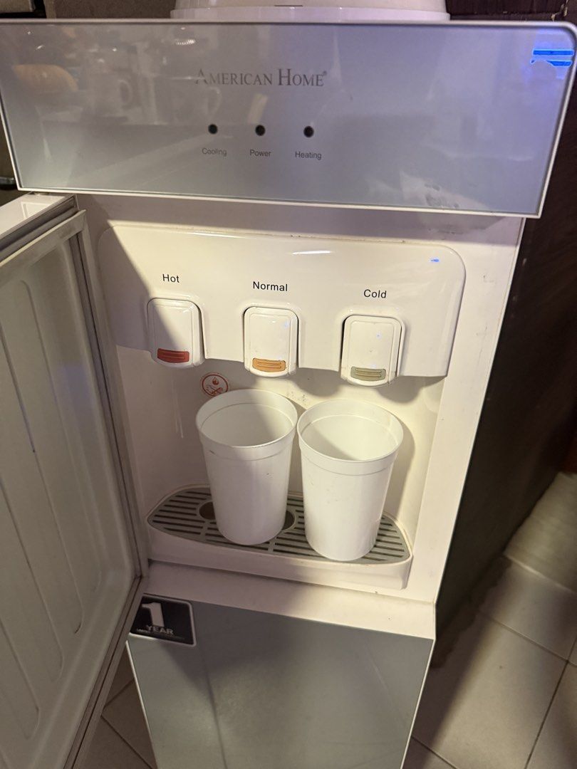 American home water dispenser (Category: Water Purifiers & Dispensers) located in Manila. Submitted by joeeey.9 (Listing ID 1467980607, Image 2). Description: Top load water dispenser Hot warm cold Issue yung gitna sa may warm may pumapatak lang pwede mabili sa orange app .