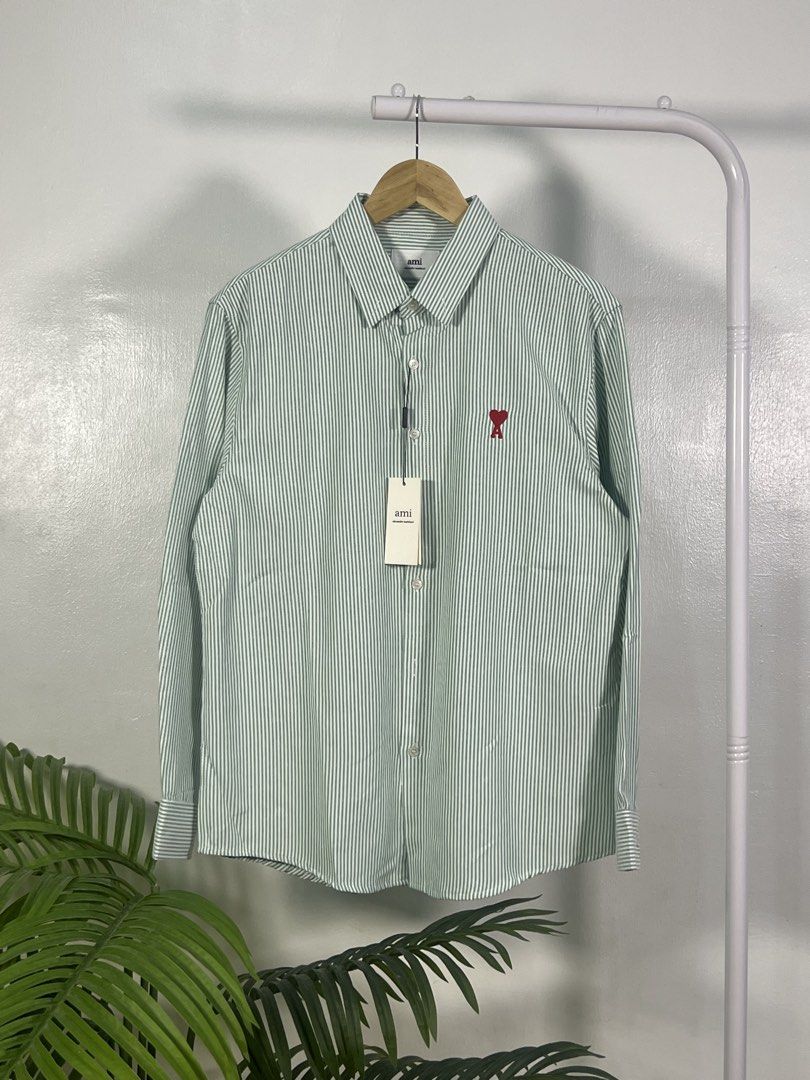 Ami small logo longsleeves (Category: Formal Shirts) located in Las Pinas. Submitted by thriftstax (Listing ID 1468051413, Image 1). Description: excellent pristine condition with hang tags large on tag stripes green 21x29.