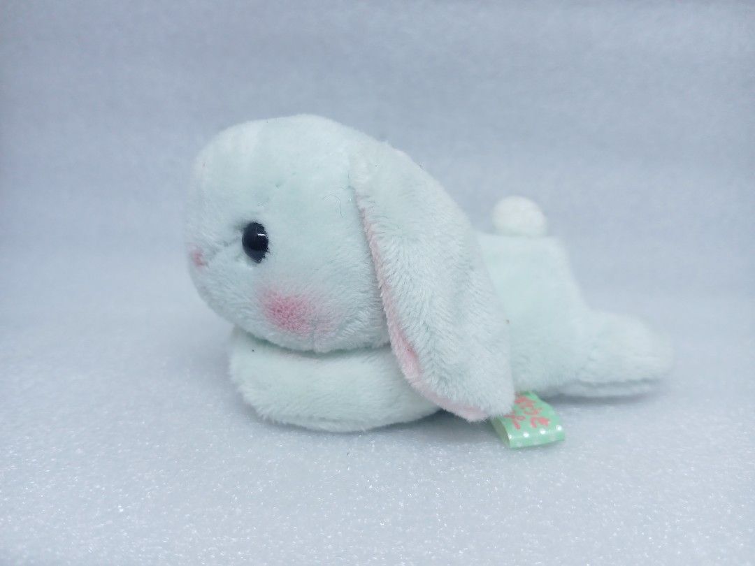 Amuse Mint Green Bunny Plush Stuffed Animal (Category: Plushies & Soft Toys) located in Pila. Submitted by Yela.ph_1 (Listing ID 1467947613, Image 2). Description: - Authentic Amuse mint green bunny plush toy - Features adorable floppy ears, rosy pink cheeks, and dark bead eyes - Comfortable lying down posture - Super soft, high-quality material - Clean surface all over with original Japanese tag attached.