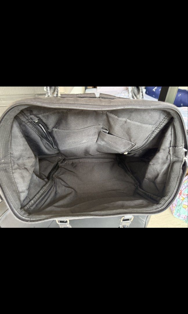 Anello Backpack (Category: Backpacks) located in Pasig City. Submitted by may_kca23 (Listing ID 1467909135, Image 3). Description: Selling my Anello backpack in black. ✨ Details: * Color: Black * Spacious main compartment * With front pocket and side pockets * Can be used for everyday errands, school, or travel Condition: Preloved, with visible signs of use, including fading, marks on the fabric, and wear on the handles and hardware. Interior app
