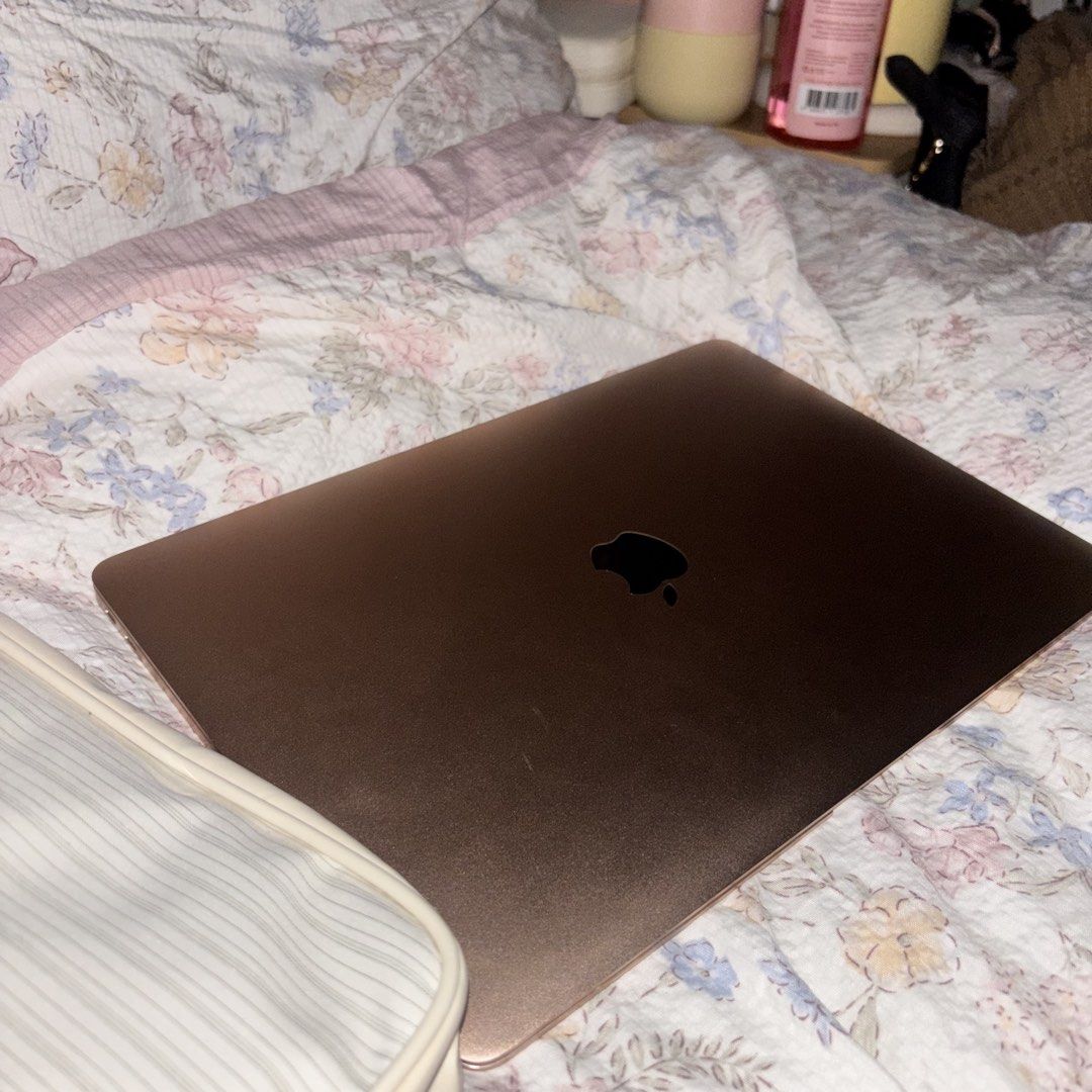 Apple MacBook Air M1 Rose Gold (Category: Laptops & Notebooks) located in Manila. Submitted by coolwolf-2135 (Listing ID 1467875997, Image 3). Description: - Model: Apple MacBook Air - Color: Gorgeous Rose Gold with black keys and classic Apple logo - Performance: Works great for daily tasks, typing, and streaming videos - Display: Crystal clear screen - Design: Sleek, thin, and very lightweight for easy travel - Freebie: Includes a laptop bag an