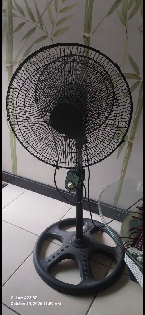 Asahi Twingo Double Head Stand Fan (Category: Fans) located in Mandaluyong City. Submitted by practical_finds (Listing ID 1467901882, Image 1). Description: - Brand: Asahi Stand Fan - Condition: Fully functional, heavy-duty cooling power - Design: Dual adjustable rotating heads with black metal grilles - Base: Sturdy wheel-style base for stability - Control: Convenient rotary speed control switch on the central pole RFS: Decluttering - Ideal for: