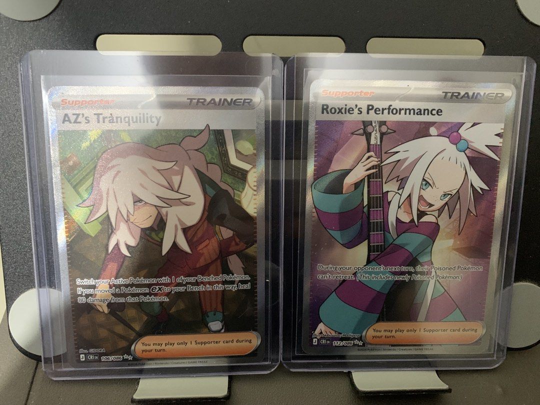 Assorted characters (Category: Raw Singles) located in Tarlac. Submitted by galaxy.in.a.sandbox (Listing ID 1467859640, Image 1). Description: - Items: AZ's Tranquility 106/086 & Roxie's Performance 112/086 (Japanese sets) - Selling as a set (pair only) - Condition: sleeved & top-loaded immediately - Feel free to message for questions!.