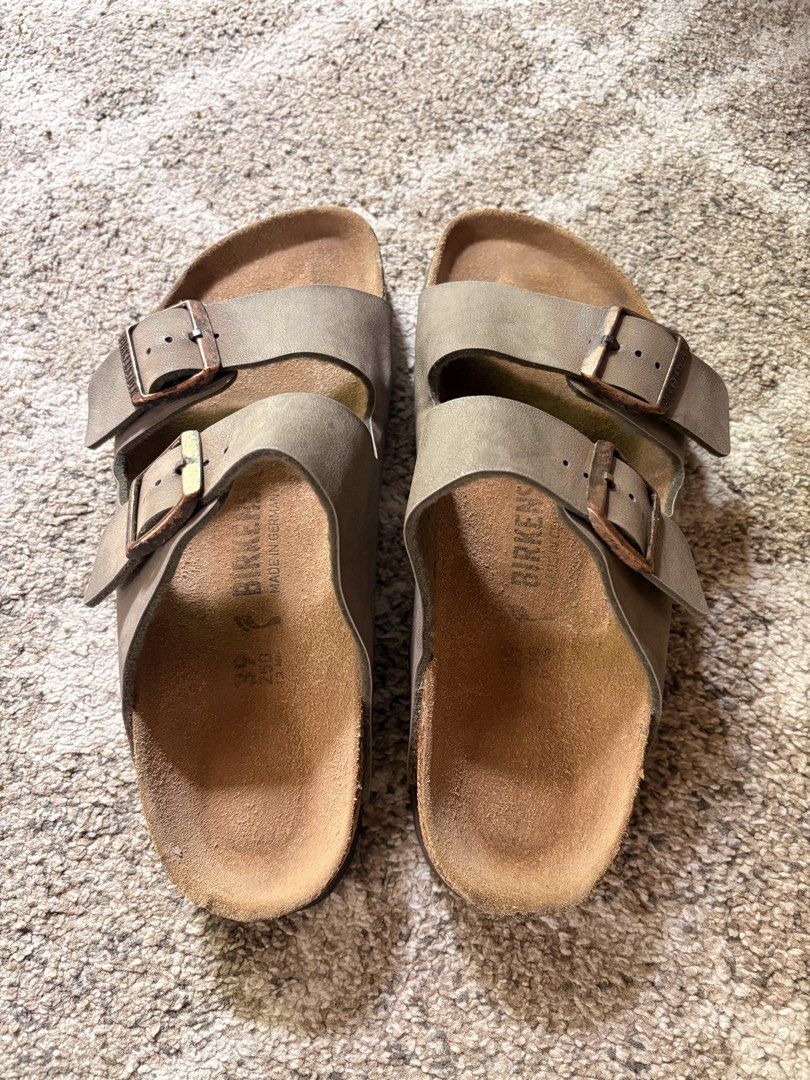 Auth Preloved Birkenstock Arizona (Category: Slippers and slides) located in Paranaque City. Submitted by silentstone.dolphin (Listing ID 1467861019, Image 2). Description: With minimal sign of used.. Stone Color.. Brass Buckle.. Visible Print.. Size 39N.. Clean&Ready to Wear..✅ Super Nice in Actual😍.