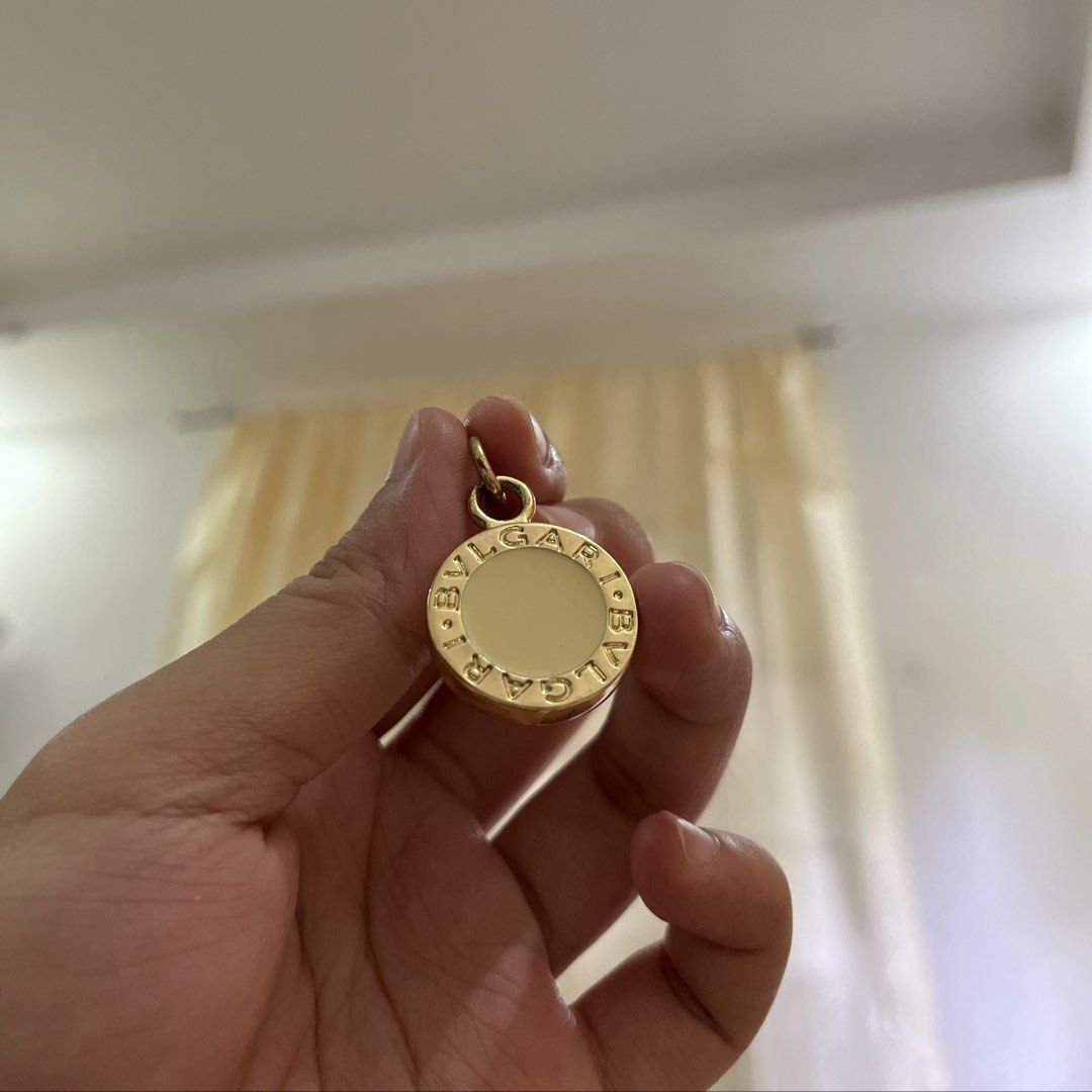 Authentic Bvlgari Gold Tone Pendant (Category: Necklaces) located in Manila. Submitted by princess.01.1 (Listing ID 1467849459, Image 1). Description: Authentic but wala na yung box. It was a gift. Doesn’t tarnish kahit ilang years na rarely used lang Looks best as a necklace, but can also be used as bag charm or keychain I have a box na bvlgari din but not yung mismong box niya. Sold separately .