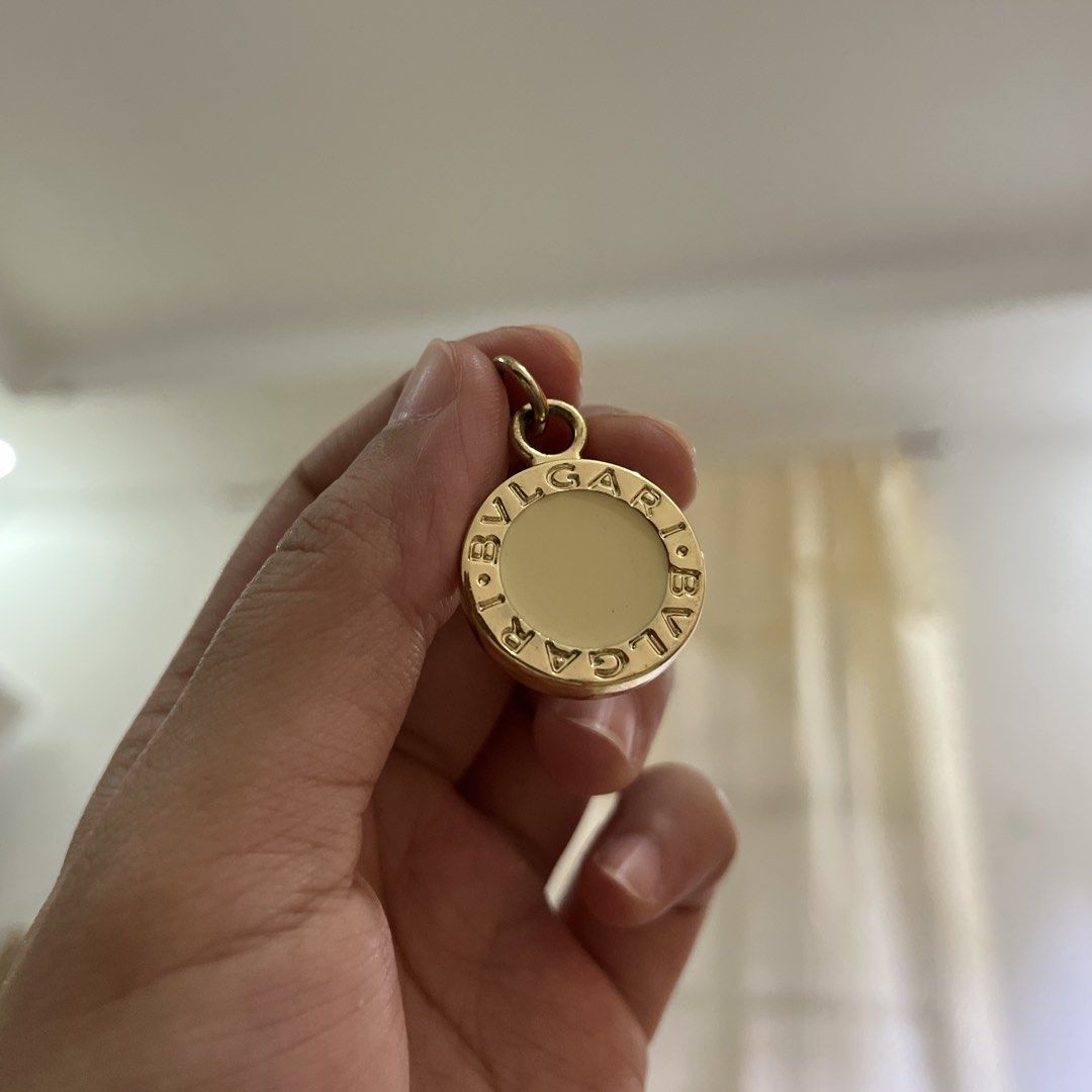 Authentic Bvlgari Gold Tone Pendant (Category: Necklaces) located in Manila. Submitted by princess.01.1 (Listing ID 1467849459, Image 2). Description: Authentic but wala na yung box. It was a gift. Doesn’t tarnish kahit ilang years na rarely used lang Looks best as a necklace, but can also be used as bag charm or keychain I have a box na bvlgari din but not yung mismong box niya. Sold separately .
