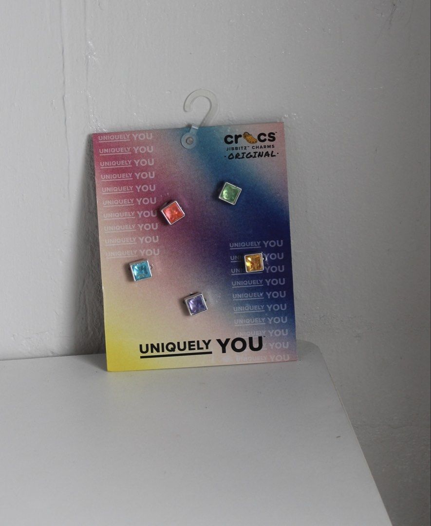 Authentic Crocs Triangle Gem 5 Pack Jibbitz Charms (Category: Charms) located in Manila. Submitted by shopfilipina1993 (Listing ID 1467958169, Image 2). Description: - Authentic Crocs Jibbitz charms - Triangle Gem 5-Pack - Includes 5 sparkly faceted gems in blue, green, orange, yellow, and purple Slightly negotiable Brand new / in mint condition Never been used.
