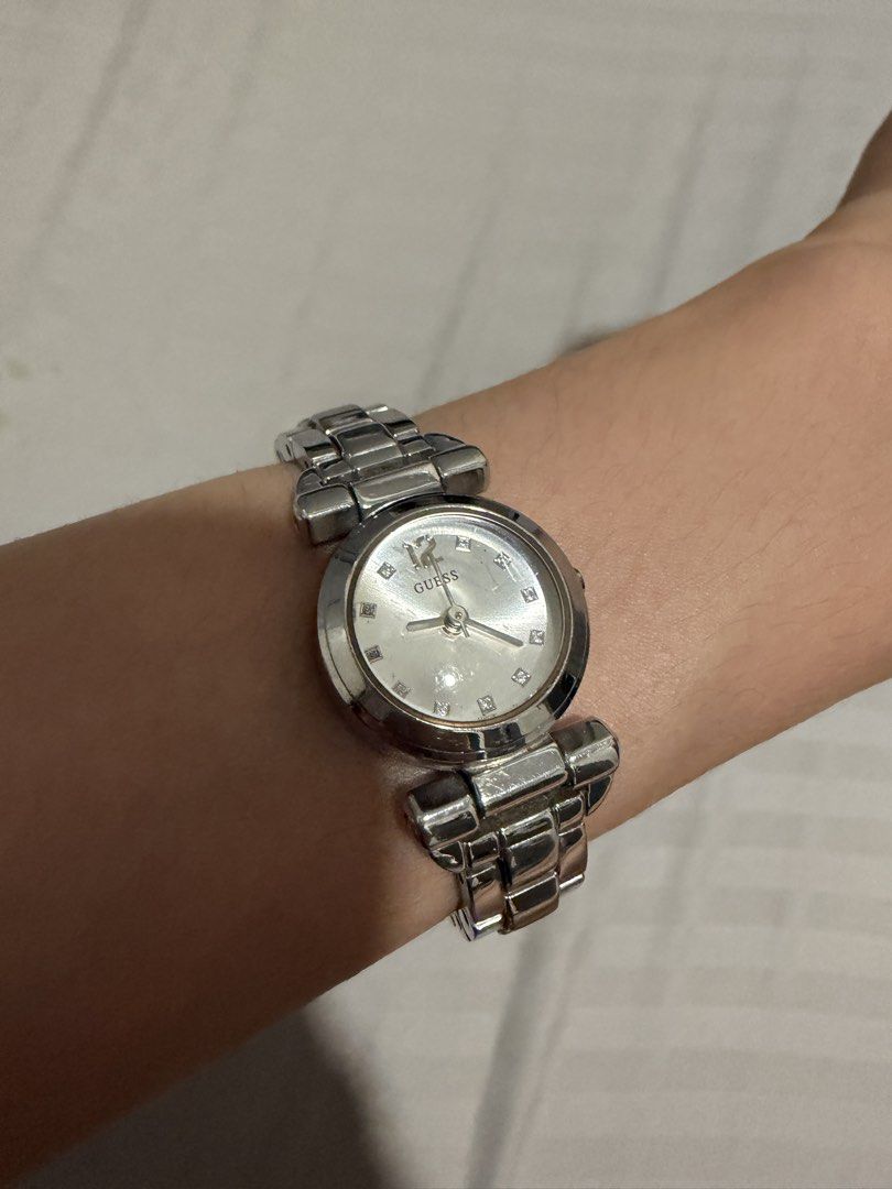 Authentic Guess Watch (Category: Women's Watches) located in Manila. Submitted by snoopydoopydoo (Listing ID 1467979734, Image 1). Description: - model: Petite WO124L1 (discontinued design) - never been used - no box - bought for P9,895 (discounted) - stainless steel, mineral glass, quartz analog, splashproof, and rain resistant.