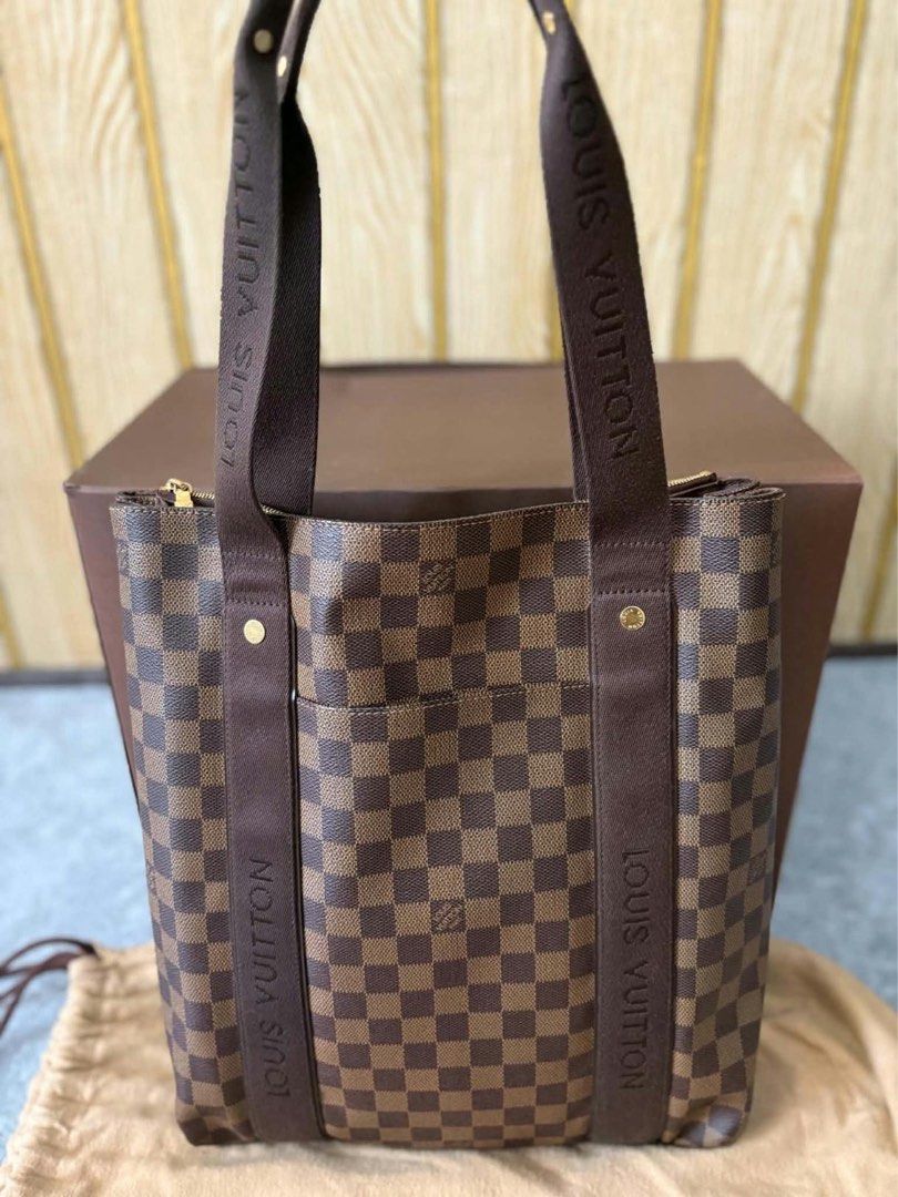 AUTHENTIC Louis Vuitton Damier Ebene Tote Bag (Category: Luxury Bags & Wallets) located in Manila. Submitted by yogirlunooo (Listing ID 1467947215, Image 2). Description: - Authentic Louis Vuitton tote bag in classic Damier Ebene canvas - Features dark brown canvas shoulder straps and gold hardware accents - Roomy interior with a secure top zip closure and convenient front slip pocket - Includes original dust bag for storage - Comes with an Entru