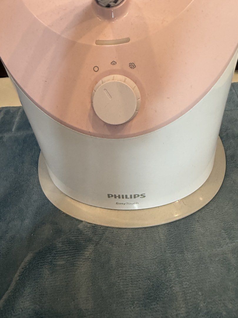 Authentic Philips EasyTouch Garment Steamer (Category: Irons & Steamers) located in Manila. Submitted by inlababoqueen (Listing ID 1467995390, Image 3). Description: - Model: Philips EasyTouch Standing Garment Steamer - Color: White and Pink - Features: Built-in clothes hanger, telescopic pole, and steam hose - Control: Simple rotary dial on the base with adjustable steam settings - Power: Ready-to-use with attached plug - Condition: Excellent wo