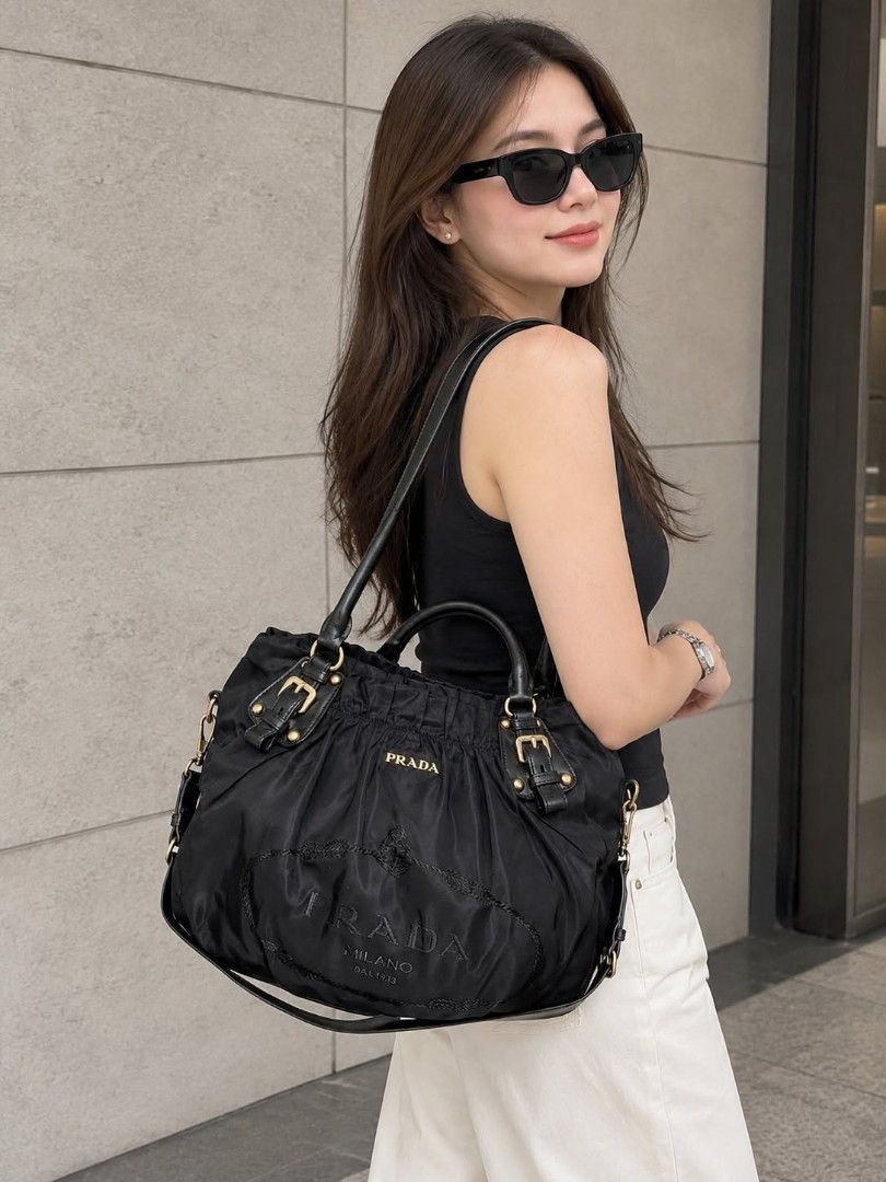 Authentic Prada 2way Bag (Category: Shoulder Bags) located in Quezon City. Submitted by luxxechic (Listing ID 1468029433, Image 2). Description: lampo under zip with original sling with serial code no issue actual photo posted japan preloved mop: gcash.