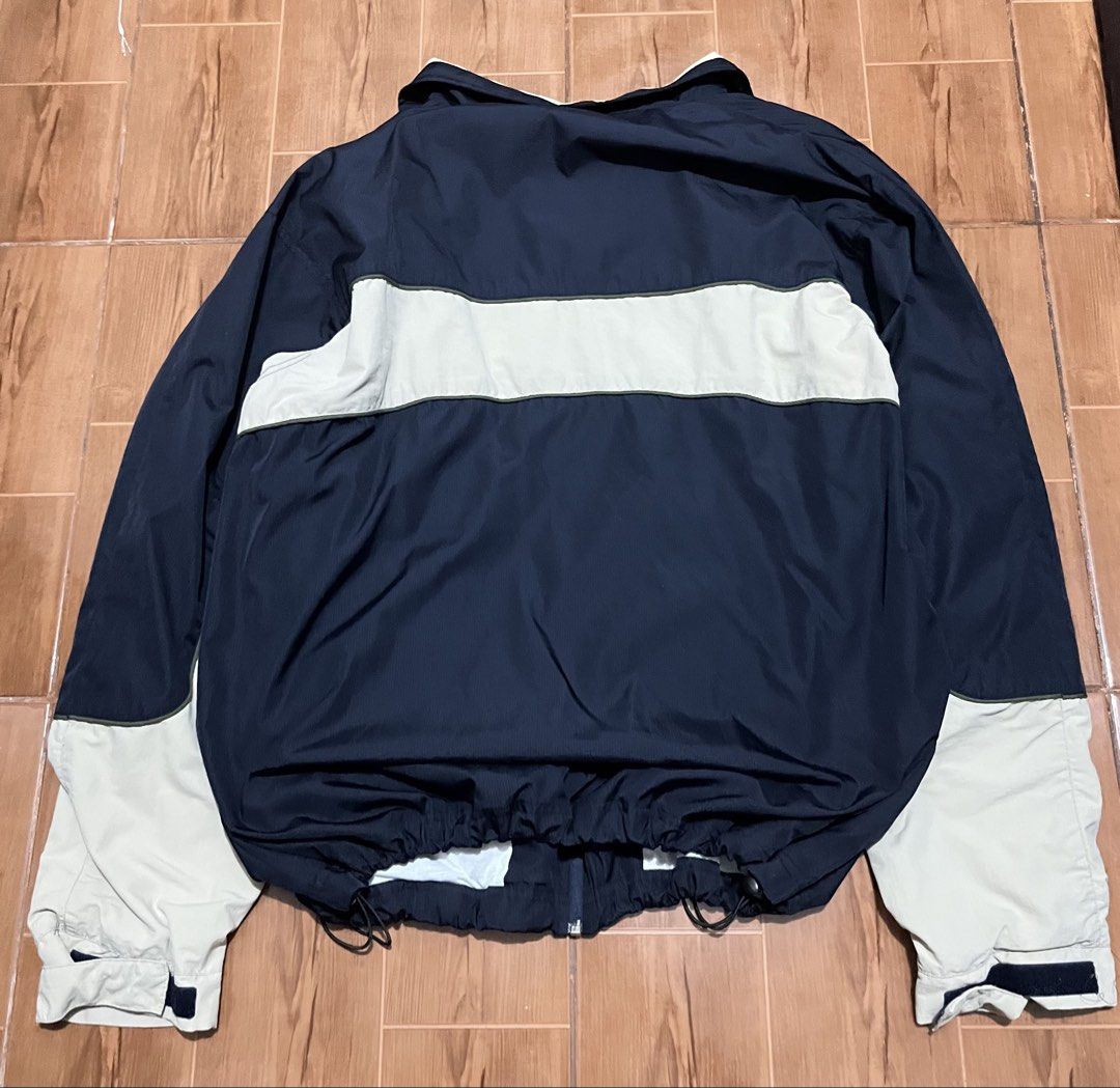 Authentic Umbro Windbreaker (Category: Coats, Jackets and Outerwear) located in Manila. Submitted by ali.preloved (Listing ID 1467968131, Image 2). Description: Vintage Umbro Navy Blue & Cream Colorblock Windbreaker Jacket | Size L Description: Vintage Umbro colorblock windbreaker in navy blue and cream ⚽ Details: * Brand: Umbro * Size: 24x 27 * Fits: Large to XL * Color: Navy blue / cream * Material: 100% nylon shell * Full-zip closure * Adjusta