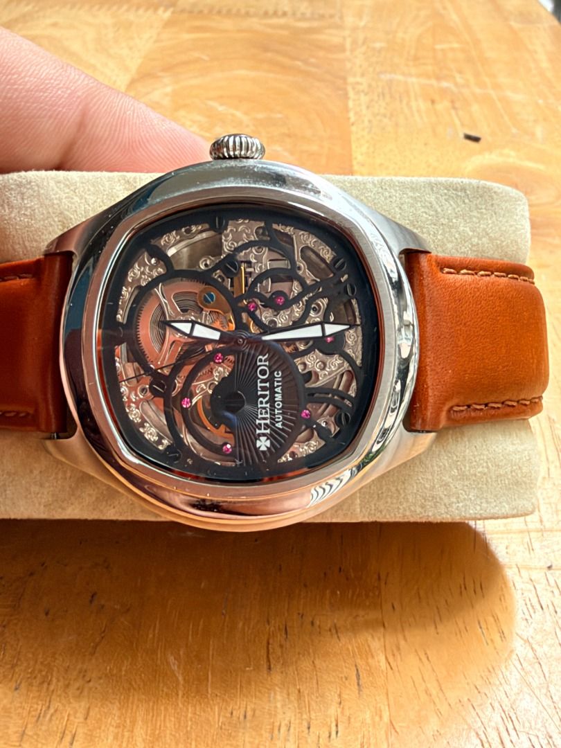 Automatic Skeleton Watch Heritor (Category: Men's Watches) located in Quezon City. Submitted by 30somethingtreasures (Listing ID 1467983938, Image 2). Description: - Brand: Heritor - Movement: Automatic, 20-jeweled with red jewel accents - Case: Silver-tone stainless steel with minor standard wear - Dial/Caseback: Transparent skeleton design - Strap: Brown leather.