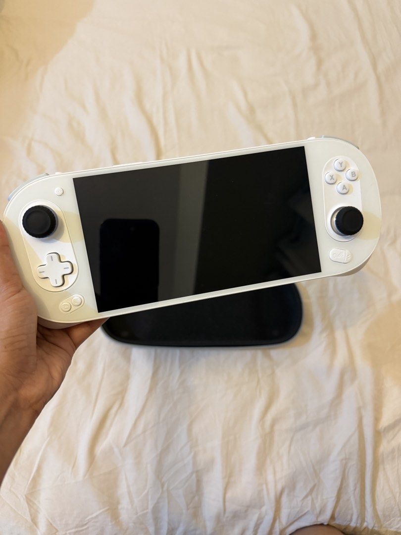 Ayaneo Pocket EVO (white) (Category: Others) located in Taguig. Submitted by prelovedby.em (Listing ID 1468020112, Image 2). Description: Inclusion: 1. 64 gb memory card with some nintendo switch, 3ds, ds, ps2 emulation games 2. Case, box, charger 3. Thumb grip no issue, rfs: too many gadgets.