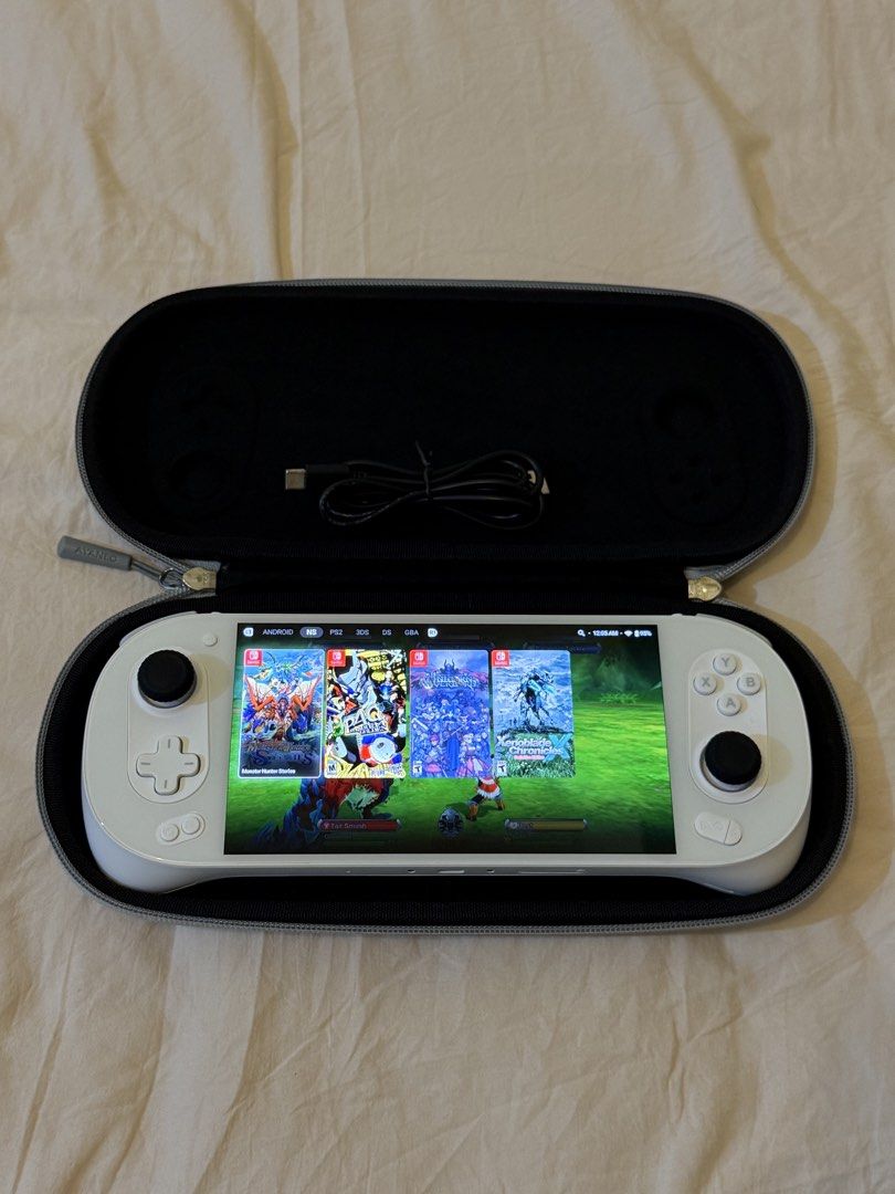 Ayaneo Pocket EVO (white) (Category: Others) located in Taguig. Submitted by prelovedby.em (Listing ID 1468020112, Image 3). Description: Inclusion: 1. 64 gb memory card with some nintendo switch, 3ds, ds, ps2 emulation games 2. Case, box, charger 3. Thumb grip no issue, rfs: too many gadgets.