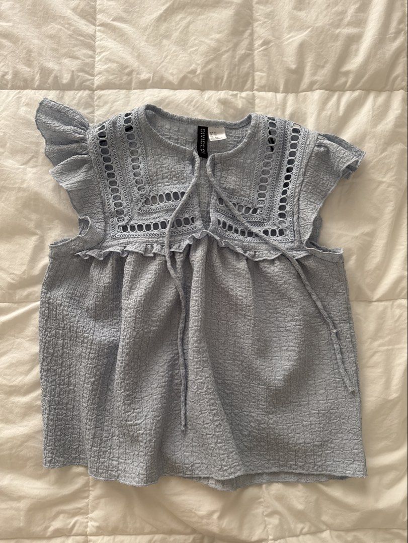 Baby blue flutter sleeve eyelet tie top (Category: Blouses) located in Makati City. Submitted by ilovefruitrollups (Listing ID 1467889597, Image 1). Description: super cute! one of my fav tops, only selling bc i dont wear it as muchh.