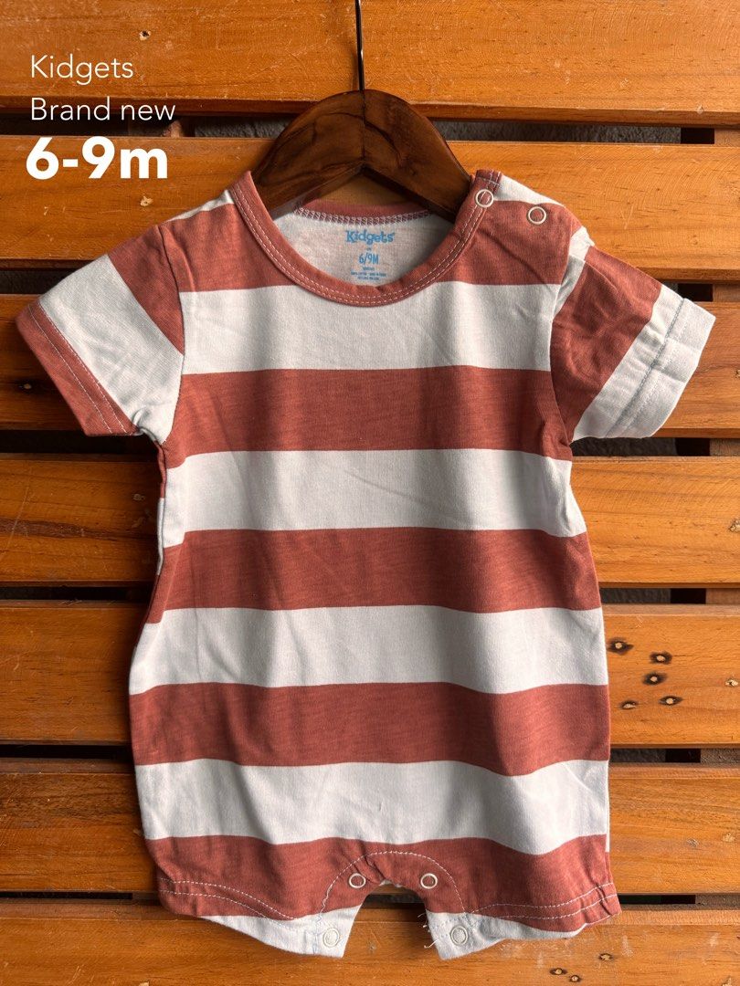Baby Romper Assorted Brands Sizes 0-9m (Category: Babies & Kids Fashion) located in Santa Rosa. Submitted by yasss23 (Listing ID 1467981682, Image 3). Description: - Bundle of 5 comfortable baby rompers - Brands: Kidgets, Duck Duck Goose - Sizes: 0-3m, 3-6m, and 6-9m - Designs: Mickey Mouse, bear prints, stripes, and dinosaur pocket - Material: Soft 100% cotton - Features: Shoulder and bottom snaps for quick diaper changes - Condition: Great for 