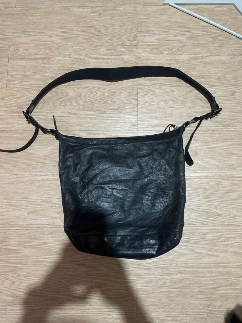 Balenciaga Black Leather Motorcycle Hobo Crossbody Bag (Category: Luxury Bags & Wallets) located in Sorsogon. Submitted by solayram0114595 (Listing ID 1467940407, Image 2). Description: - Brand: Balenciaga - Color: Classic Black - Material: Genuine distressed leather with natural wear - Hardware: Iconic motorcycle metal details and studs - Compartments: Roomy main interior with front zipper pocket - Strap: Adjustable shoulder strap with metal buc