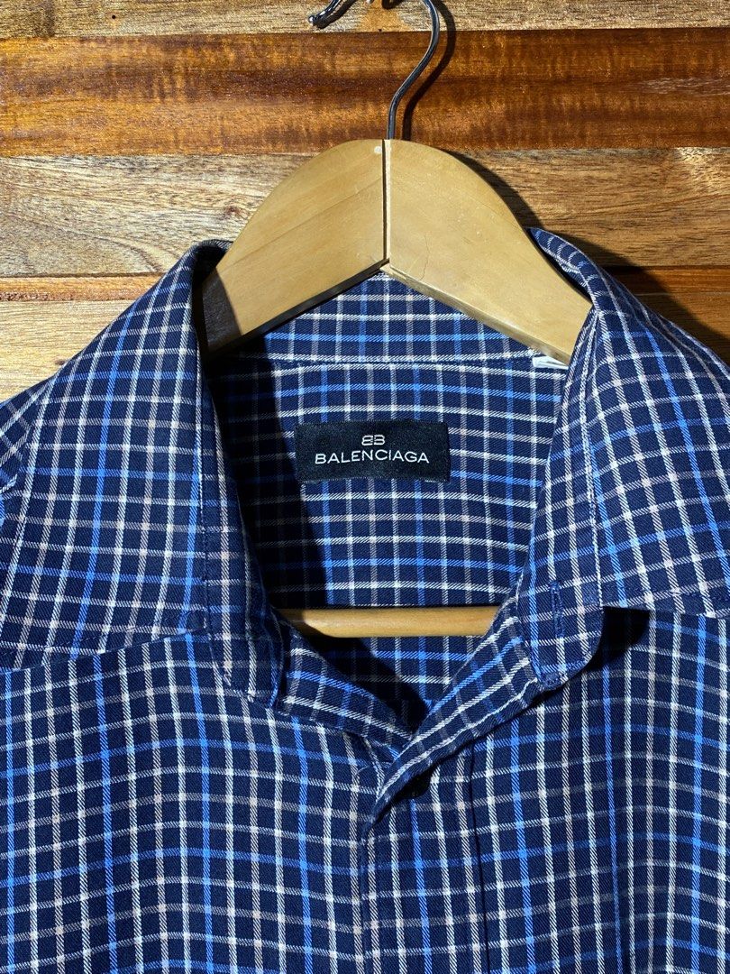 Balenciaga Blue Plaid Shirt (Category: Luxury Apparel) located in Caloocan City. Submitted by rhouzze.ph (Listing ID 1467966909, Image 3). Description: Name: Balenciaga Plaid Polo Dimensions: 24 by 30 Size: Large Condition: Excellent Condition Issue: None.