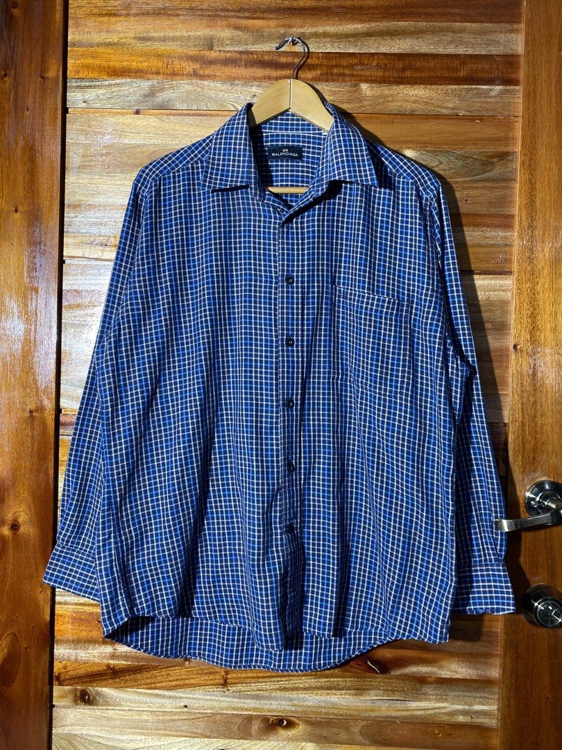 Balenciaga Blue Plaid Shirt (Category: Luxury Apparel) located in Caloocan City. Submitted by rhouzze.ph (Listing ID 1467966909, Image 1). Description: Name: Balenciaga Plaid Polo Dimensions: 24 by 30 Size: Large Condition: Excellent Condition Issue: None.