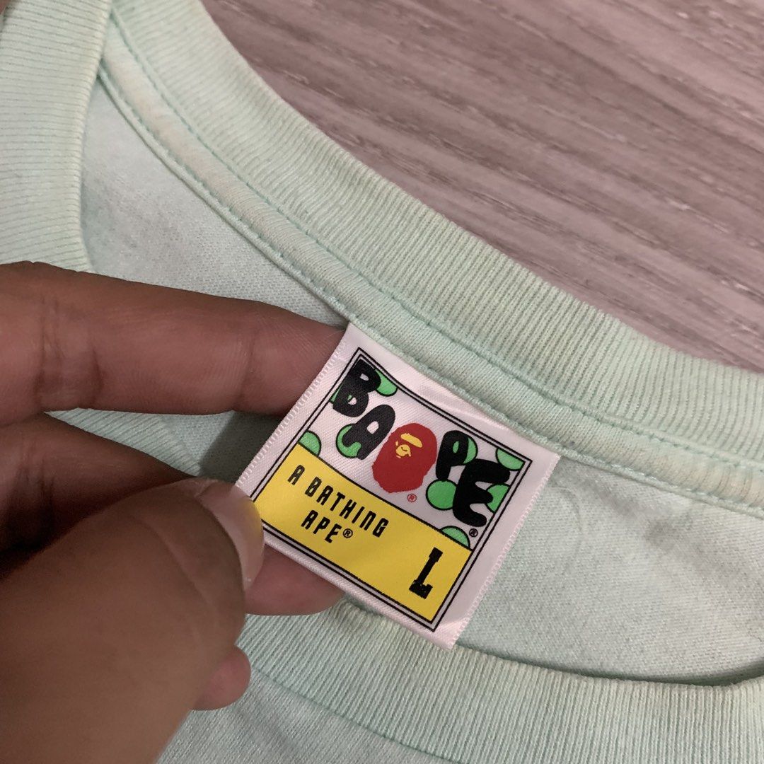 Bape bighead (Category: Tshirts & Polo Shirts ) located in Cavite. Submitted by yobubsss (Listing ID 1468050829, Image 3). Description: Size Large 21w 28L Good condition Issue scratch sa print see last 2pic washable stain sa neckline .