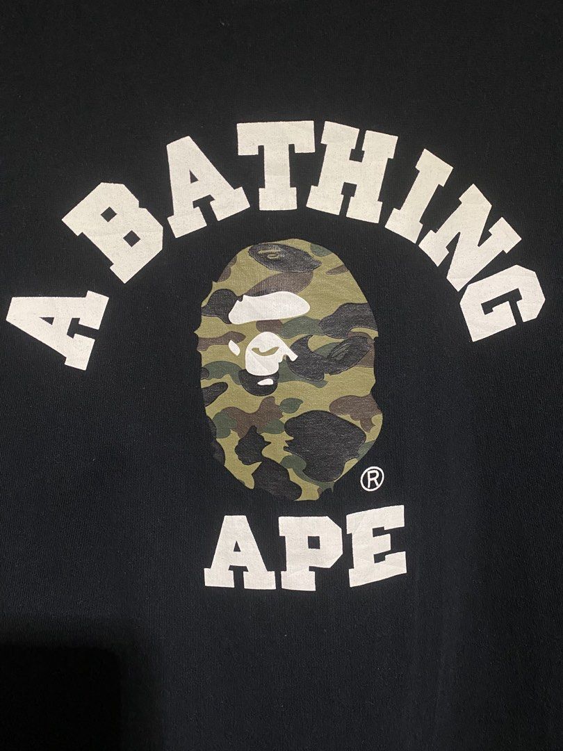 BAPE College tee Camo size Large (Category: Tshirts & Polo Shirts ) located in Manila. Submitted by drp4drp (Listing ID 1467934564, Image 3). Description: Length 27 Width 21 9.4/10 color rate or better Excellent condition No cracks on print nakakasakal pa neck niyan slightly nego sa sure buyer - Brand: A Bathing Ape (BAPE) - Color: Black - Size: Large - Material: 100% cotton with standard crew neck - Design: Classic arched chest lettering with ic