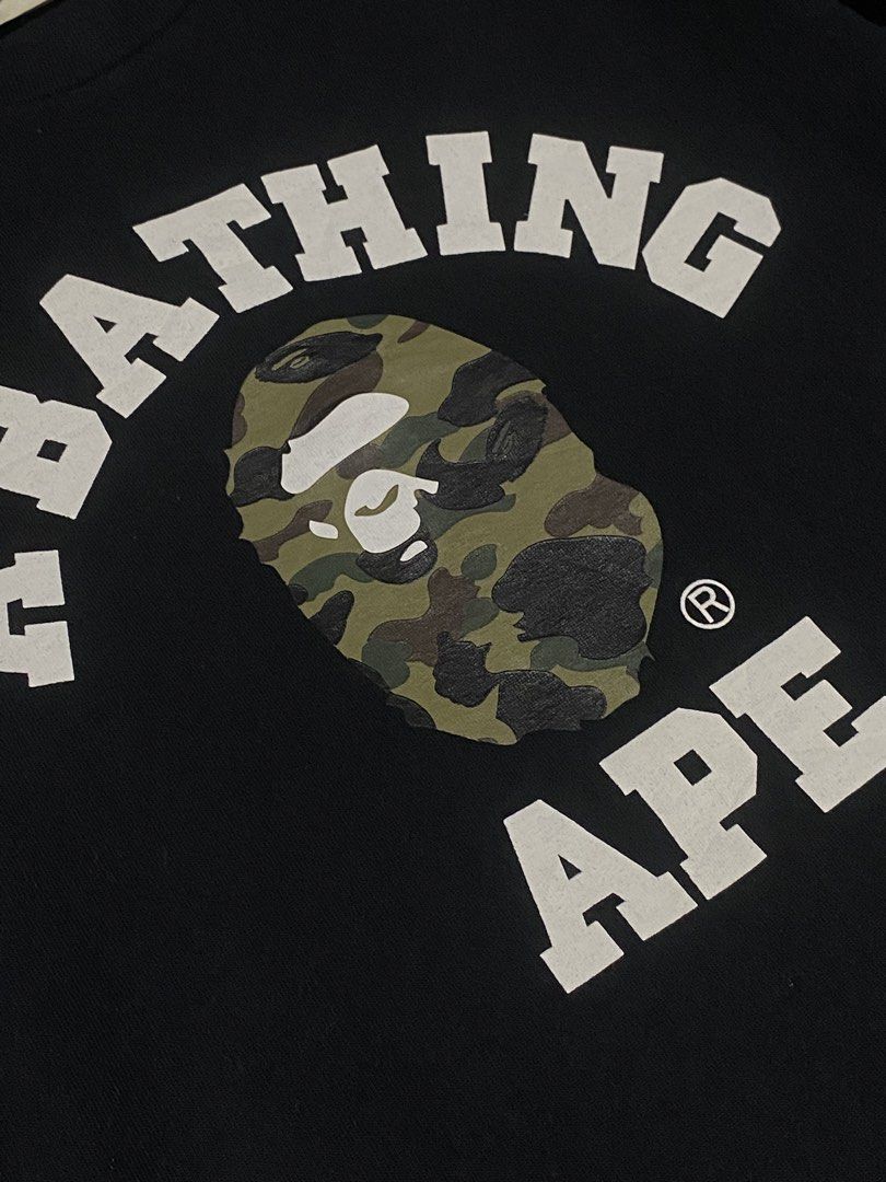 BAPE College tee Camo size Large (Category: Tshirts & Polo Shirts ) located in Manila. Submitted by drp4drp (Listing ID 1467934564, Image 2). Description: Length 27 Width 21 9.4/10 color rate or better Excellent condition No cracks on print nakakasakal pa neck niyan slightly nego sa sure buyer - Brand: A Bathing Ape (BAPE) - Color: Black - Size: Large - Material: 100% cotton with standard crew neck - Design: Classic arched chest lettering with ic