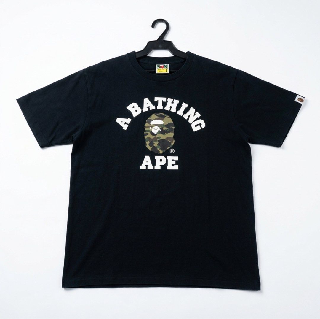 BAPE College tee Camo size Large (Category: Tshirts & Polo Shirts ) located in Manila. Submitted by drp4drp (Listing ID 1467934564, Image 1). Description: Length 27 Width 21 9.4/10 color rate or better Excellent condition No cracks on print nakakasakal pa neck niyan slightly nego sa sure buyer - Brand: A Bathing Ape (BAPE) - Color: Black - Size: Large - Material: 100% cotton with standard crew neck - Design: Classic arched chest lettering with ic