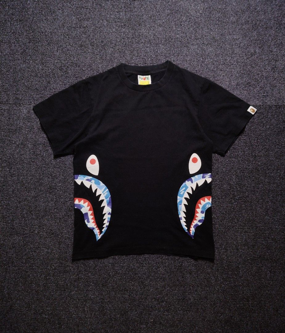BAPE Side Camo Shark Tee ( orig ) (Category: Tshirts & Polo Shirts ) located in Quezon City. Submitted by wgapparel (Listing ID 1468016265, Image 3). Description: 📌 available 18 x 23.5 W/L ( Small on tag ) Excellent condition Complete tags Orig 💯 Color rate 10/10 No issue Black na black pa. 🔥 💰 Mine 1800 * Color may vary due to lighting * Always check posted pics for details * DM for any concerns about the item 📩Dm to purchase Disclaimer: I'