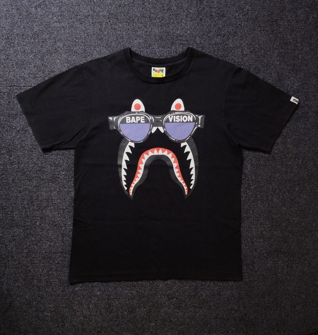 BAPE vision shark black Tee (Category: Tshirts & Polo Shirts ) located in Quezon City. Submitted by wgapparel (Listing ID 1468018340, Image 3). Description: 📌 available 20 x 26 W/L ( medium on tag ) Brand new condition Complete tags Orig 💯 Color rate 10/10 No issue 💰 Mine 2490 * Color may vary due to lighting * Always check posted pics for details * DM for any concerns about the item 📩Dm to purchase Disclaimer: I'm not associated or affiliate