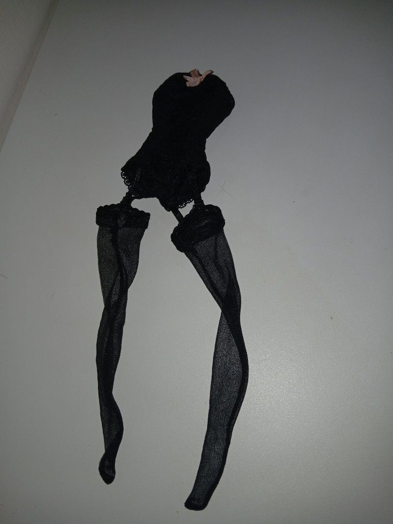 Barbie lingerie vintage (Category: Action & Battle Toys) located in Subic. Submitted by frncnjntmr22 (Listing ID 1468054905, Image 1). Description: - Scale: Fits standard fashion dolls - Material: Stretchy black mesh fabric with delicate lace trim - Design: Complete set with attached thigh-high stockings - Detail: Features a sweet pale pink satin ribbon on the front.
