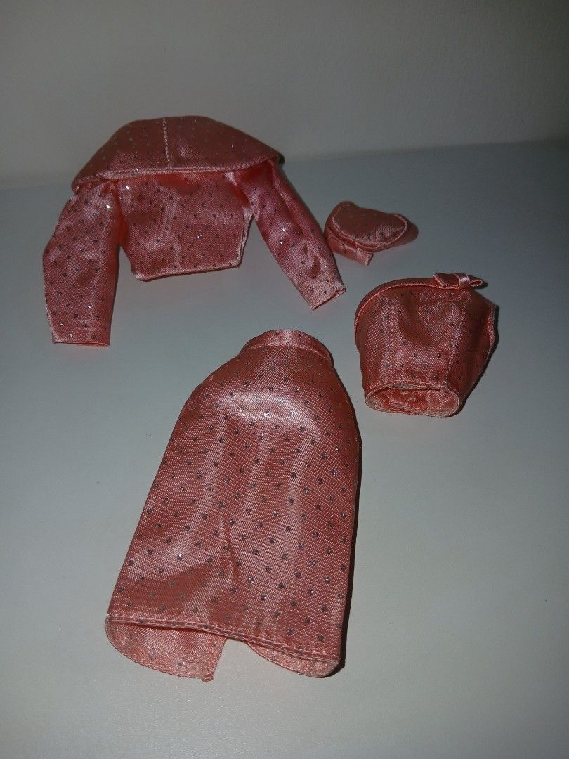 Barbie Sparkling Repro dress set (Category: Kids Toys) located in Subic. Submitted by frncnjntmr22 (Listing ID 1468029252, Image 2). Description: - Pink sparkly doll outfit set - Includes long sleeve jacket, matching skirt, hat, and tiny purse - Shimmery fabric dotted with cute details - Features a doll label inside the jacket collar used as display only.