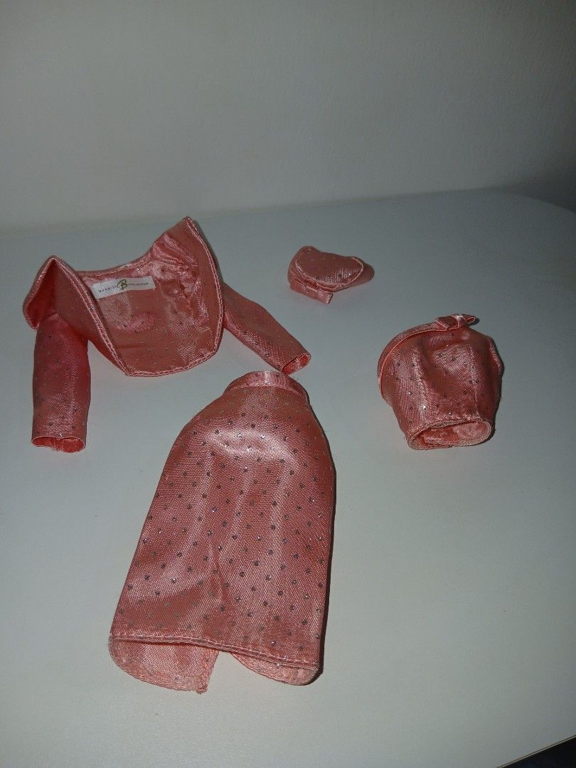 Barbie Sparkling Repro dress set (Category: Kids Toys) located in Subic. Submitted by frncnjntmr22 (Listing ID 1468029252, Image 1). Description: - Pink sparkly doll outfit set - Includes long sleeve jacket, matching skirt, hat, and tiny purse - Shimmery fabric dotted with cute details - Features a doll label inside the jacket collar used as display only.