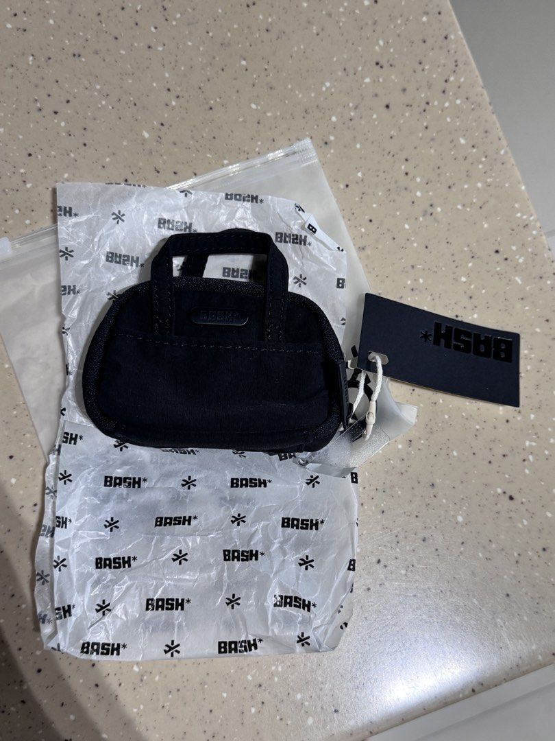Bash Manila Weekender Charm (Carbon) (Category: Wallets & Card holders) located in Marikina City. Submitted by skincaremnlatbp (Listing ID 1462351760, Image 2). Description: Limited edition freebie No price posted Highest offer for this.