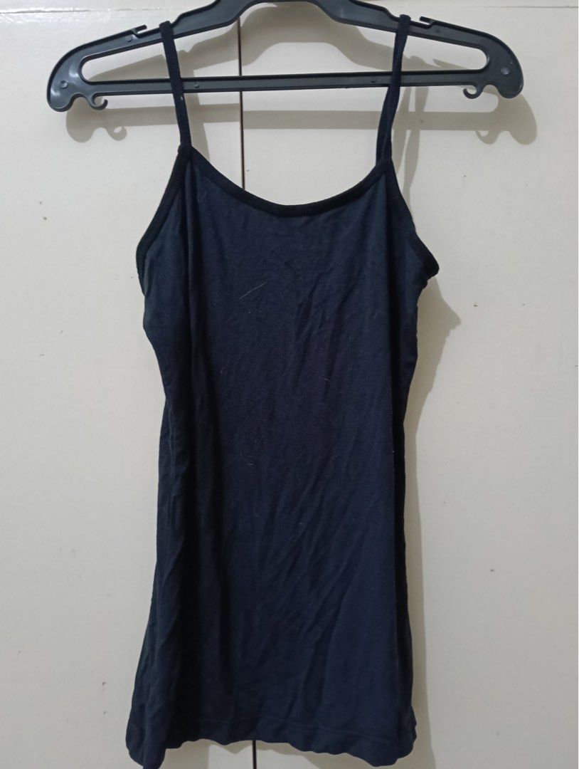 Basic Black Spaghetti Strap Tank Top Cami (Category: Sleeveless) located in Manila. Submitted by goddesssy (Listing ID 1467840064, Image 1). Description: - Color: Solid black - Style: Simple tank top with thin spaghetti straps and scoop neckline - Fabric: Soft and stretchy for all-day comfort - Fit: Standard fit - Versatility: Great basic piece for layering or wearing solo.