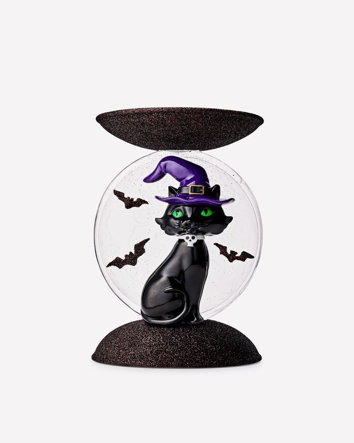 Bath & Body Works Black Cat Light Up Candle Holder (Category: Home Fragrance) located in Quezon City. Submitted by houseoftoni (Listing ID 1467961671, Image 2). Description: - Authentic Bath & Body Works Halloween Candle Holder - Design: Black cat with a purple witch hat in front of a glowing moon backdrop - Details: Features a glittery brown base and top tray - Condition: Brand new with original hang tag (Tag says: "I light up") - Availability: 