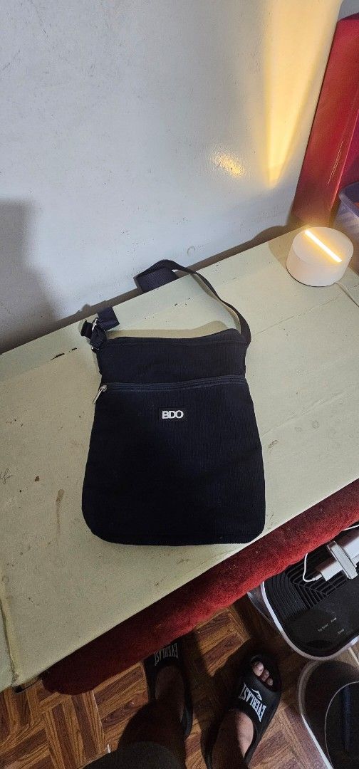 BDO Blue Sling Bag Crossbody Bag (Category: Cross-body Bags) located in Manila. Submitted by anthonylee23810 (Listing ID 1467937068, Image 1). Description: - Brand: BDO - Color: Blue - Type: Compact sling / crossbody bag - Features: Secure front pocket with zipper closure - Strap: Adjustable for a custom fit - Material: Clean and durable fabric - Best for: Daily errands, travel, and casual outings.