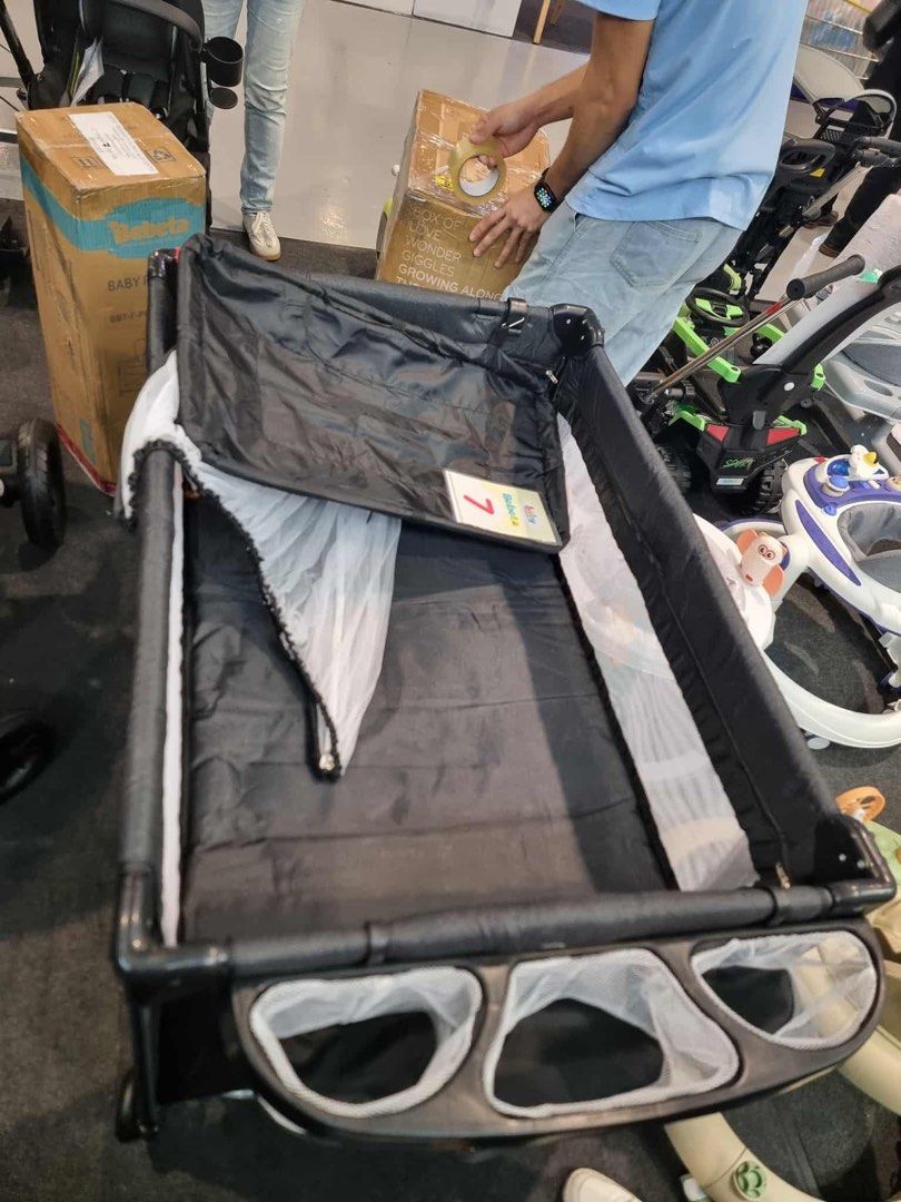 Bebeta Baby Playard Crib (Category: Cots & Cribs) located in Rizal. Submitted by roldanroxanne1129 (Listing ID 1467963268, Image 2). Description: - Brand: Bebeta - Color: Solid black - Design: Breathable mesh sides for airflow and visibility - Extras: Attached storage pockets for bottles/toys, mattress base, and mosquito net - Portability: Easy to fold up and store - Condition: Great for everyday use.