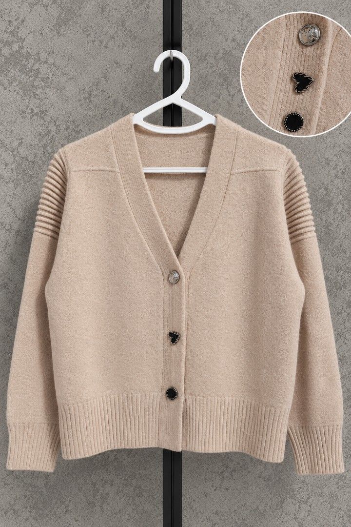 Beige Knit Cardigan V-neck (Category: Coats, Jackets and Outerwear) located in Taguig. Submitted by roniquefinds (Listing ID 1467862068, Image 1). Description: - Color: Beige - Style: Relaxed fit V-neck knit cardigan - Details: Unique metallic and black enamel front buttons with ribbed texture on shoulders and sleeves - Condition: Excellent.