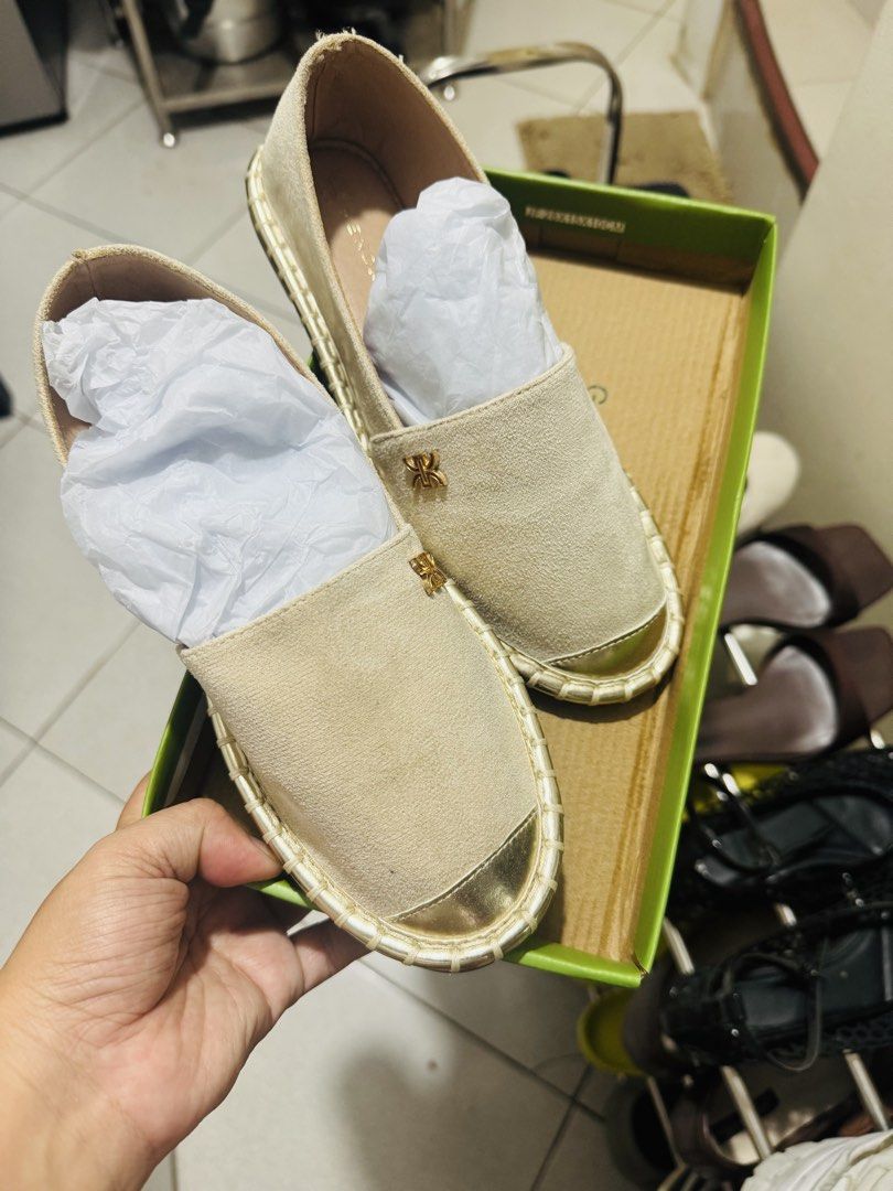 Beige Suede Espadrilles with Gold Toe Cap (Category: Flats & Sandals) located in Marilao. Submitted by cj458678 (Listing ID 1467871791, Image 1). Description: - Condition: Brand new, never worn (fresh out of the box) - Material: Beige suede upper with woven jute midsole - Design: Slip-on style featuring metallic gold toe caps and small gold logo hardware - Inclusions: Comes with original green shoebox and tissue paper stuffing.