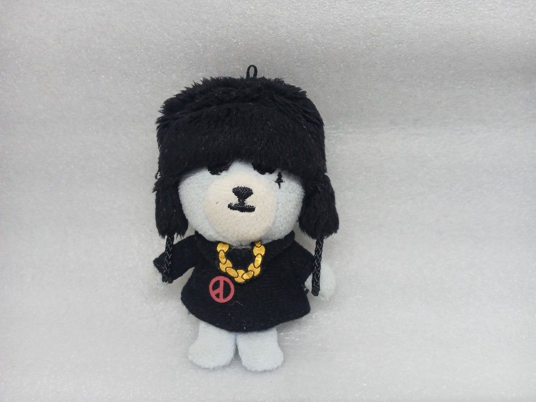 BIGBANG Krunk Plush Keychain (Category: Plushies & Soft Toys) located in Pila. Submitted by Yela.ph_1 (Listing ID 1467945967, Image 1). Description: - Official YG Entertainment merchandise - BIGBANG Krunk plush keychain - Wears a black ushanka hat, matching black outfit, gold chain, and pink peace symbol shirt - White bear body with official YG tag on the back - Great accessory for hanging on bags or keys.