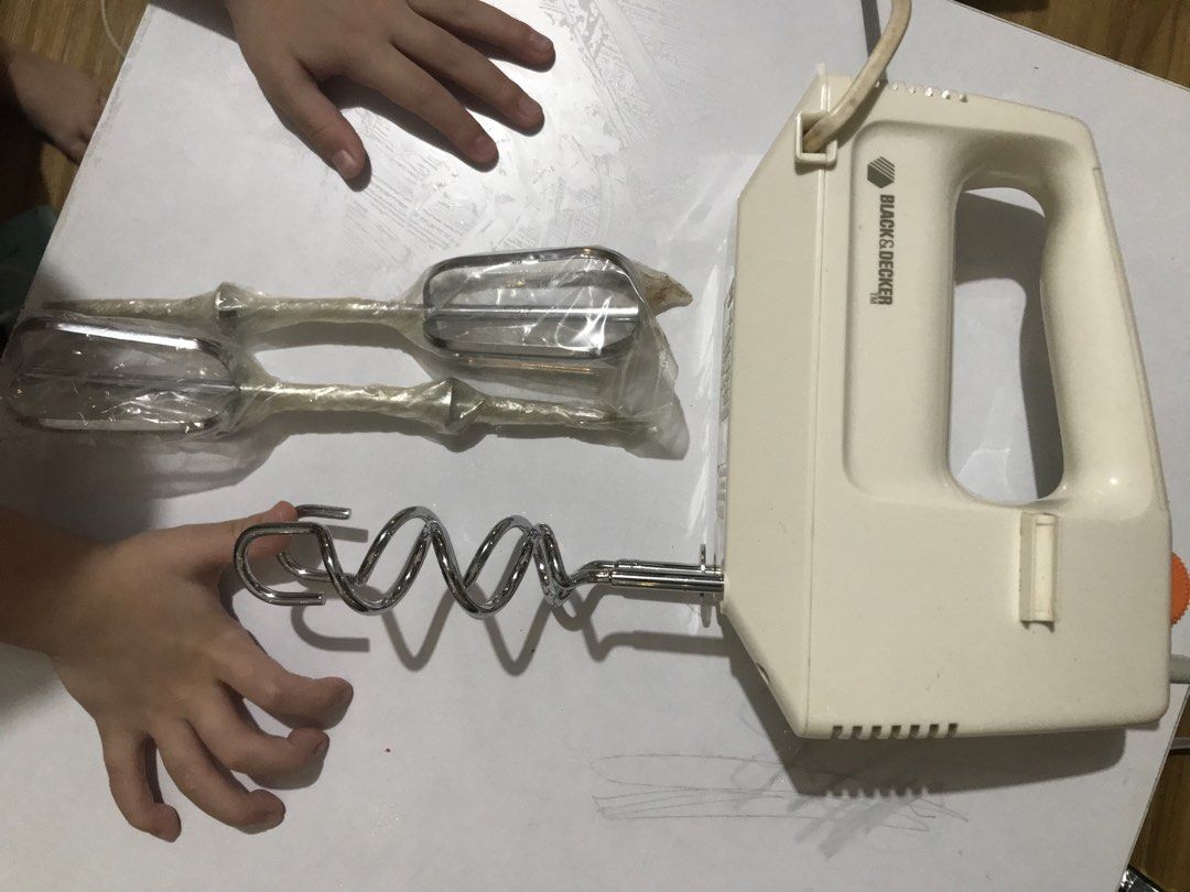 Black & Decker Hand Mixer with Beaters and Dough Hooks (Category: Hand & Stand Mixers) located in Taytay. Submitted by laine2023 (Listing ID 1468017475, Image 1). Description: - Brand: Black & Decker electric hand mixer (White) - Inclusions: 2 standard beaters (still in plastic wrapping) and 2 spiral dough hooks - Features: Convenient speed control wheel located on top of the handle - Condition: Fully functional with normal signs of previous kitc