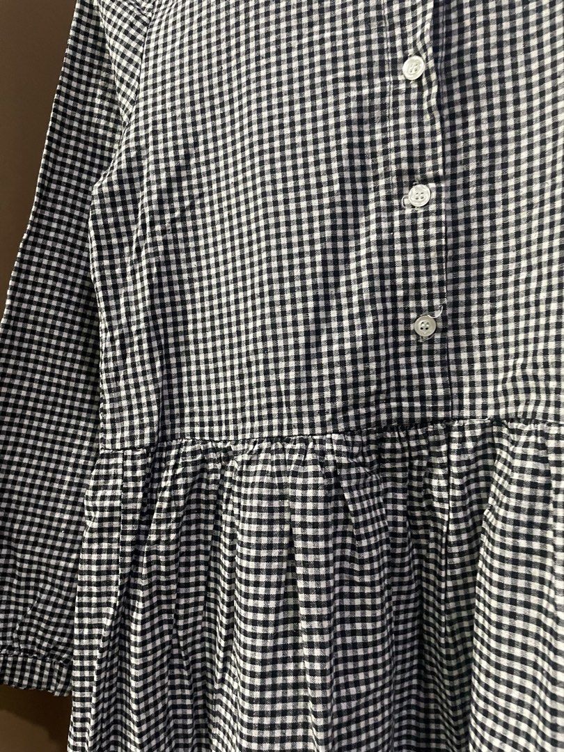 Black and White Gingham Button-Down Dress S-SM (Category: Dresses) located in Quezon City. Submitted by smileclothingline (Listing ID 1467841750, Image 3). Description: Black and white checkered gingham dress with long sleeves and front button closure. Mandarin collar style. Gathered waistline creates a tiered skirt look. Size S to SM. Measurements: width 15 inches, length 32 inches. Clean pattern, comfortable everyday wear. Ready to ship..