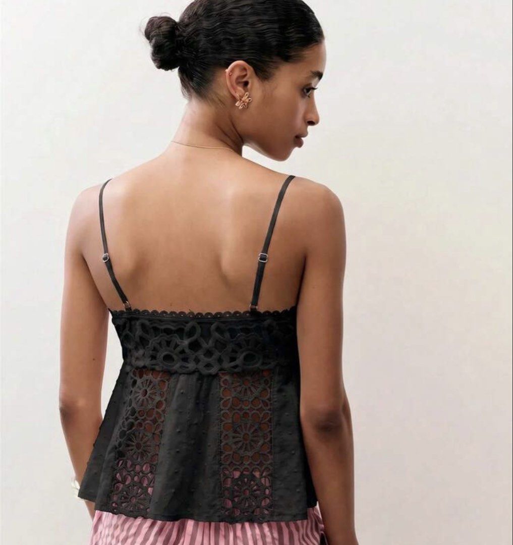 Black eyelet camisole top with spaghetti straps (Category: Sleeveless) located in Bacolor. Submitted by prelovedbyellimac (Listing ID 1467847661, Image 2). Description: - Color: Black - Details: Intricate eyelet lace panels, scalloped neckline trim, and front/back lace cut-outs - Fit: Adjustable spaghetti straps and a flared peplum silhouette - Fabric: Lightweight textured dot material - Styling: Perfect for warm weather layering or pairing with 