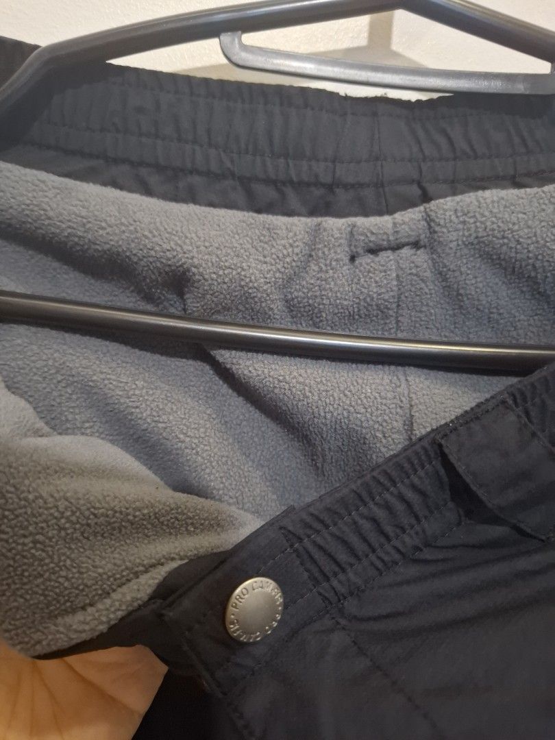 Black Fleece Lined Winter Pants with Drawstring Cuffs, waterproof (Category: Babies & Kids Fashion) located in Imus. Submitted by maggieforce (Listing ID 1467934118, Image 3). Description: - worn by my 7Y son (33 to 34kg) - Color: Solid black with a warm grey fleece interior lining - Closure: Elastic waistband with a secure snap button - Pockets: Convenient zippered side pockets for small essentials - Protection: Drawstring adjustable ankles to s