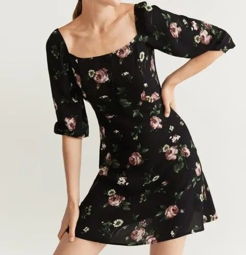Black Floral Square Neck Mini Dress (Category: Dresses) located in Manila. Submitted by lindylulu (Listing ID 1467871371, Image 2). Description: - Size Eur S / US 4 - Style: Black mini dress with all-over pink rose and white daisy print - Design: Square neckline with front button details and 3/4 puff sleeves - Fabric: Lightweight and comfortable for all-day wear - Perfect for: Casual day outs, dates, or weekend errands.