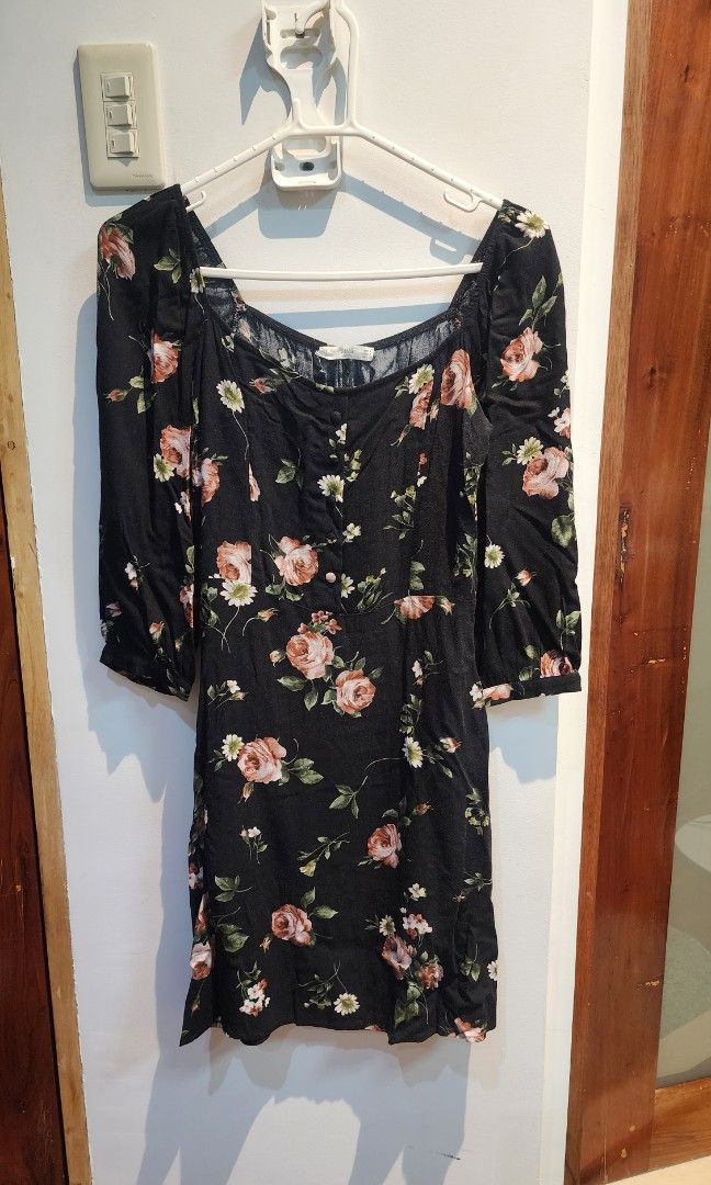 Black Floral Square Neck Mini Dress (Category: Dresses) located in Manila. Submitted by lindylulu (Listing ID 1467871371, Image 3). Description: - Size Eur S / US 4 - Style: Black mini dress with all-over pink rose and white daisy print - Design: Square neckline with front button details and 3/4 puff sleeves - Fabric: Lightweight and comfortable for all-day wear - Perfect for: Casual day outs, dates, or weekend errands.
