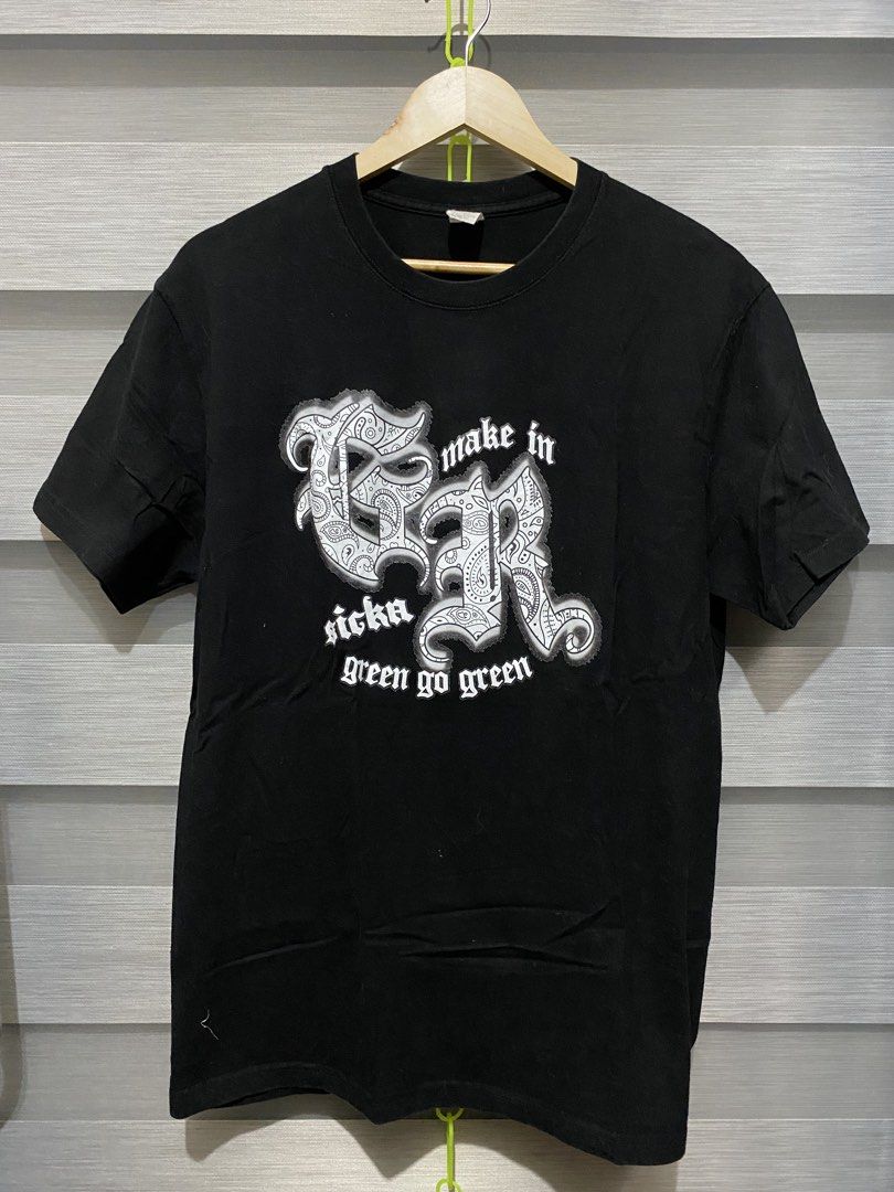 Black Graphic Tee with Paisley Lettering (Category: Activewear) located in Butuan. Submitted by nielben13 (Listing ID 1467850423, Image 1). Description: - Color: Black - Fit: Standard fit, crew neckline - Design: Large white chest graphic featuring ornate paisley patterns and streetwear text ("make in", "sicka", "green go green") - Style: Casual everyday streetwear - Condition: Brand new/Excellent quality.